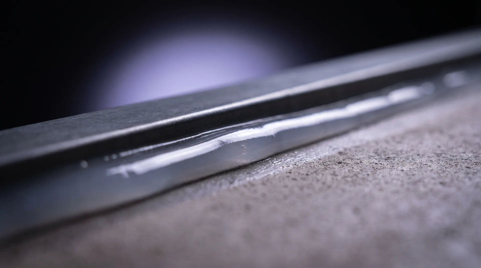 Close-up of a flawless silicone caulk bead along a clean junction