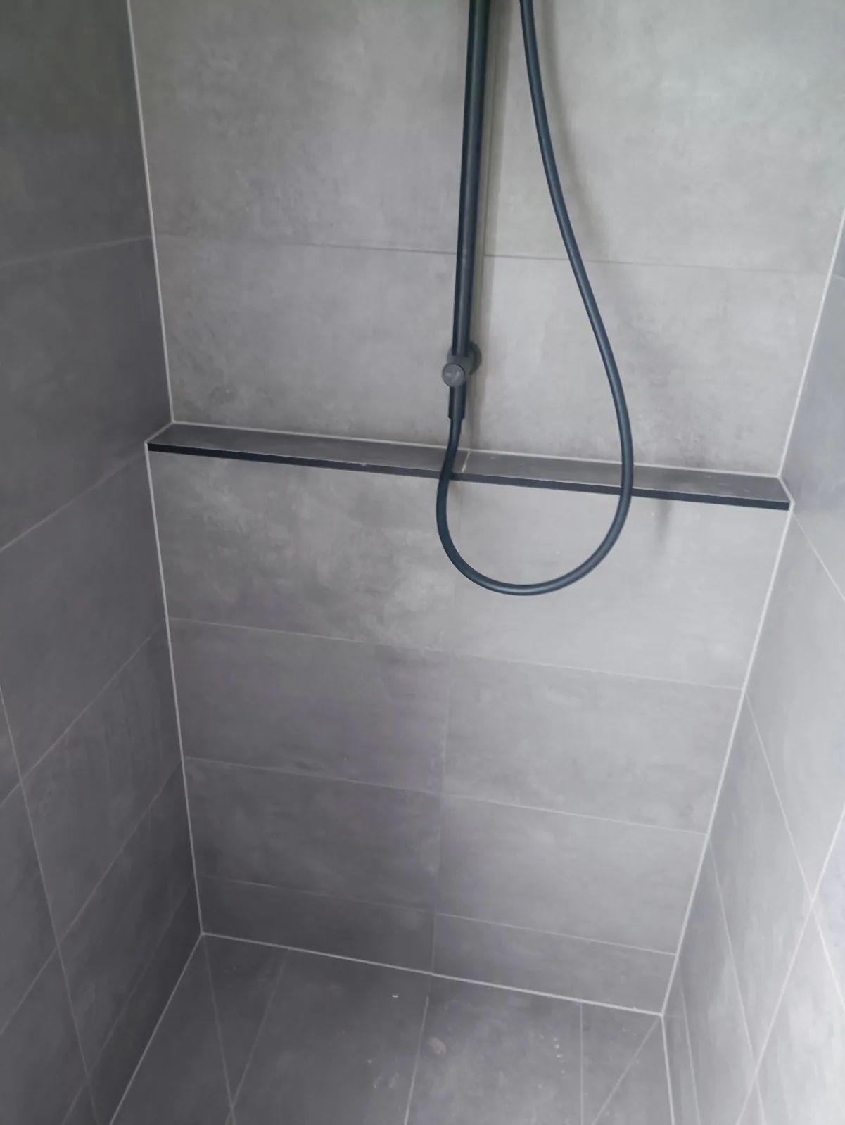 Tiled shower niche with precise caulked edges, Melbourne bathroom