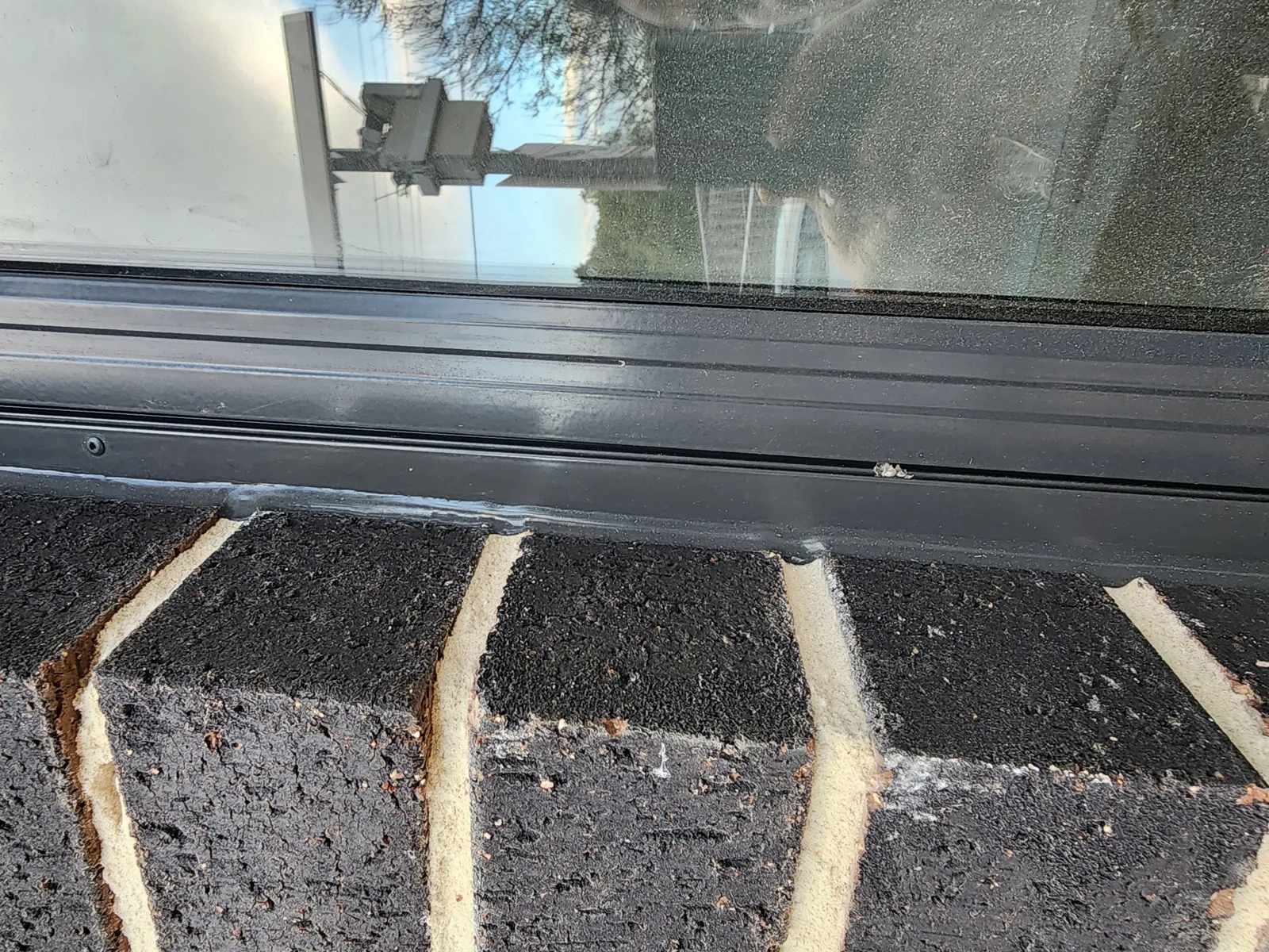 Exterior window sill weatherproofed with a clean silicone bead, Melbourne